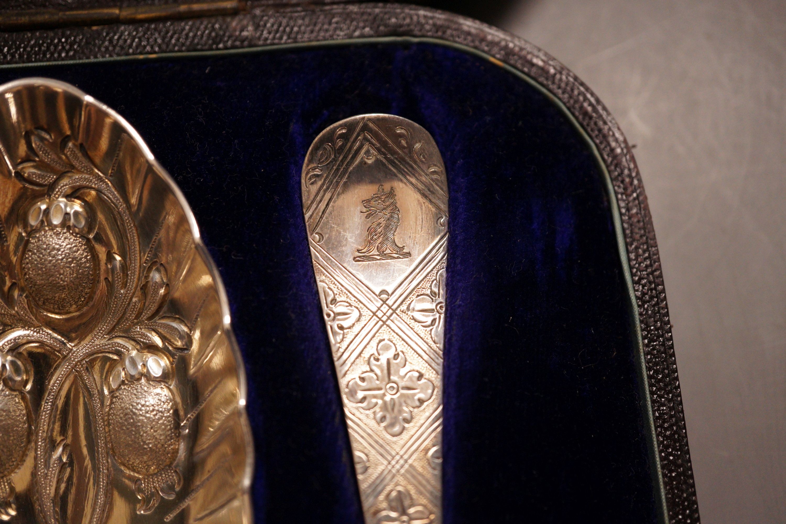 A cased set of Mappin & Webb plated berry spoons